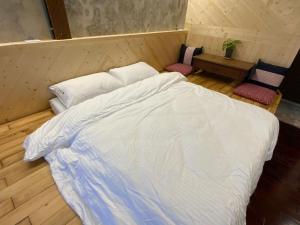 Voodi või voodid majutusasutuse Yilan For A Night B&B toas