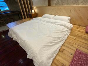 Voodi või voodid majutusasutuse Yilan For A Night B&B toas