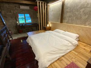 Voodi või voodid majutusasutuse Yilan For A Night B&B toas