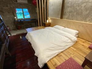 Voodi või voodid majutusasutuse Yilan For A Night B&B toas