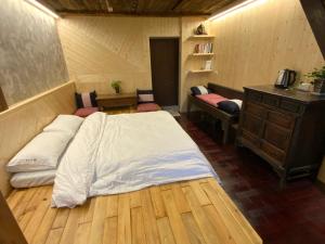 Voodi või voodid majutusasutuse Yilan For A Night B&B toas