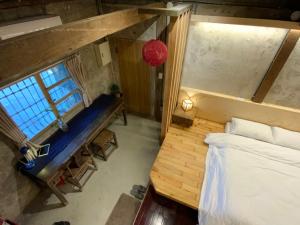 Voodi või voodid majutusasutuse Yilan For A Night B&B toas