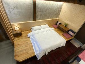 Voodi või voodid majutusasutuse Yilan For A Night B&B toas