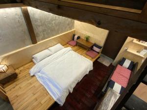 Voodi või voodid majutusasutuse Yilan For A Night B&B toas