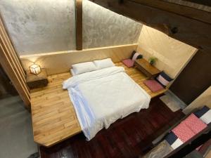 Voodi või voodid majutusasutuse Yilan For A Night B&B toas