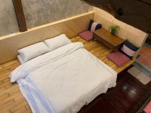 Voodi või voodid majutusasutuse Yilan For A Night B&B toas