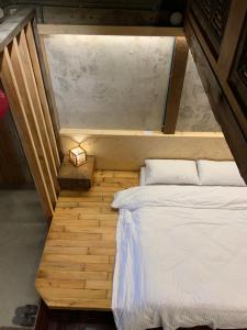 Voodi või voodid majutusasutuse Yilan For A Night B&B toas