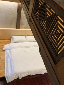 Voodi või voodid majutusasutuse Yilan For A Night B&B toas