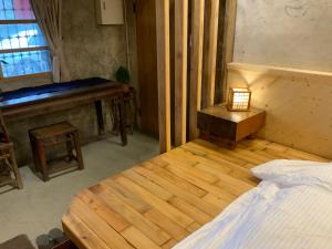 Voodi või voodid majutusasutuse Yilan For A Night B&B toas