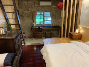 Voodi või voodid majutusasutuse Yilan For A Night B&B toas