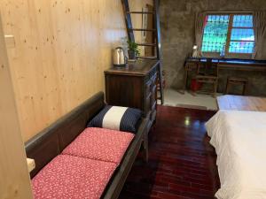 Voodi või voodid majutusasutuse Yilan For A Night B&B toas