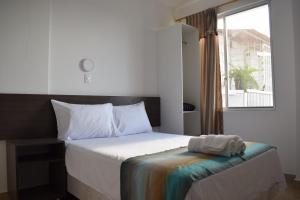 En eller flere senger på et rom på Mare S&M Casa Hostal