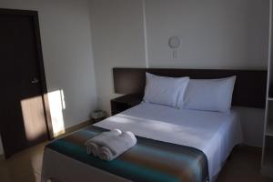 En eller flere senger på et rom på Mare S&M Casa Hostal