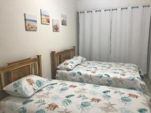 Postel nebo postele na pokoji v ubytování Playa Caracol Beachfront Residence Club + 31 fotografií