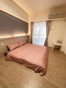 Postel nebo postele na pokoji v ubytování 樂室Room