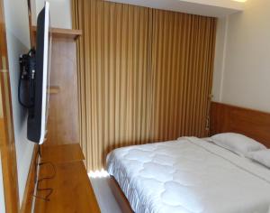 Rúm í herbergi á Diva Residence