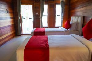 Postel nebo postele na pokoji v ubytování La'villaris hotel & resto + 15 fotografií