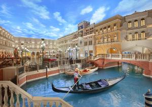 a small boat in the middle of a large body of water at The Palazzo at The Venetian® in Las Vegas