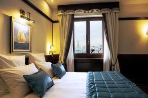 Uma cama ou camas num quarto em Hotel Bucintoro