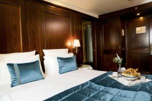 Uma cama ou camas num quarto em Hotel Bucintoro