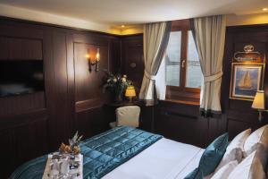 Uma cama ou camas num quarto em Hotel Bucintoro