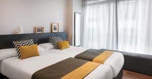 Łóżko lub łóżka w pokoju w obiekcie Gran View Apartments