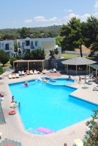 a large swimming pool with people in a resort at Summer Dream Hotel By Anayia All Inclusive Resorts in Theologos +36 photos