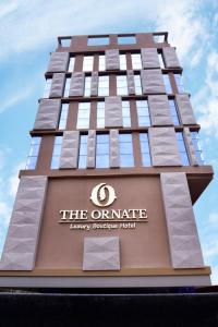 a tall building with the omaha living services hotel at The Ornate in Guwahati