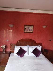 Säng eller sängar i ett rum på Hotel Al Kabir