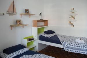 Letto o letti in una camera di Calypso Appartamento