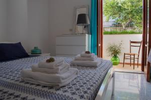 Letto o letti in una camera di Calypso Appartamento
