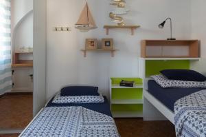 Letto o letti in una camera di Calypso Appartamento