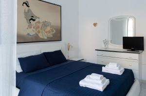 Letto o letti in una camera di Calypso Appartamento
