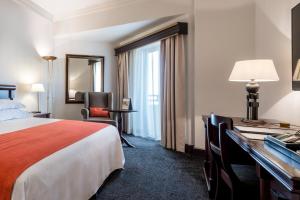 Voodi või voodid majutusasutuse Hotel Alvalade toas