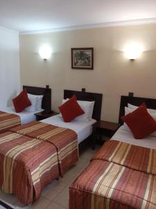 Postel nebo postele na pokoji v ubytování Hotel Al Kabir