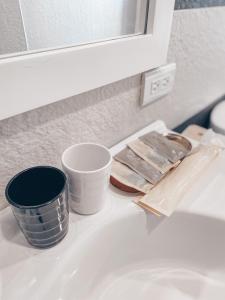 a bathroom sink with some dishes on top of it at 辰瑄星辰包棟民宿-Star Sky烤肉ktv看星星包棟民宿 in Wujie