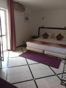 Postel nebo postele na pokoji v ubytování Hotel Al Kabir