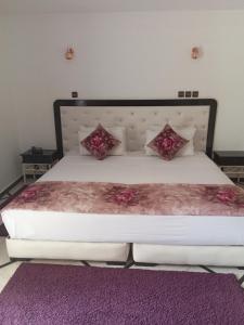 Postel nebo postele na pokoji v ubytování Hotel Al Kabir