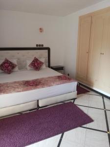 Postel nebo postele na pokoji v ubytování Hotel Al Kabir