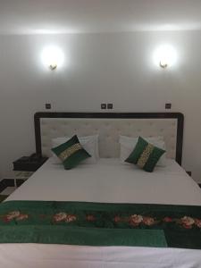 Postel nebo postele na pokoji v ubytování Hotel Al Kabir