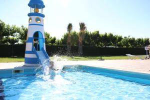 
a swimming pool with a blue and white swimming pool at Camping Platja Cambrils in Cambrils
