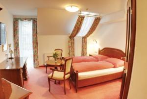 מיטה או מיטות בחדר ב-Hotel Kaiser
