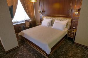 Katil atau katil-katil dalam bilik di Rozafa Hotel
