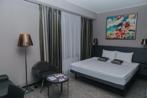 Ein Bett oder Betten in einem Zimmer der Unterkunft Mercure Kyiv Congress