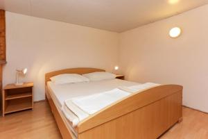 Postel nebo postele na pokoji v ubytování Lapad View Apartments