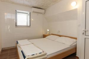 Postel nebo postele na pokoji v ubytování Lapad View Apartments