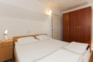 Postel nebo postele na pokoji v ubytování Lapad View Apartments