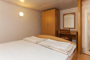 Postel nebo postele na pokoji v ubytování Lapad View Apartments