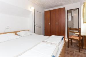 Postel nebo postele na pokoji v ubytování Lapad View Apartments