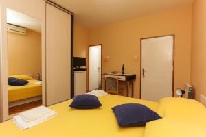Postel nebo postele na pokoji v ubytování Lapad View Apartments